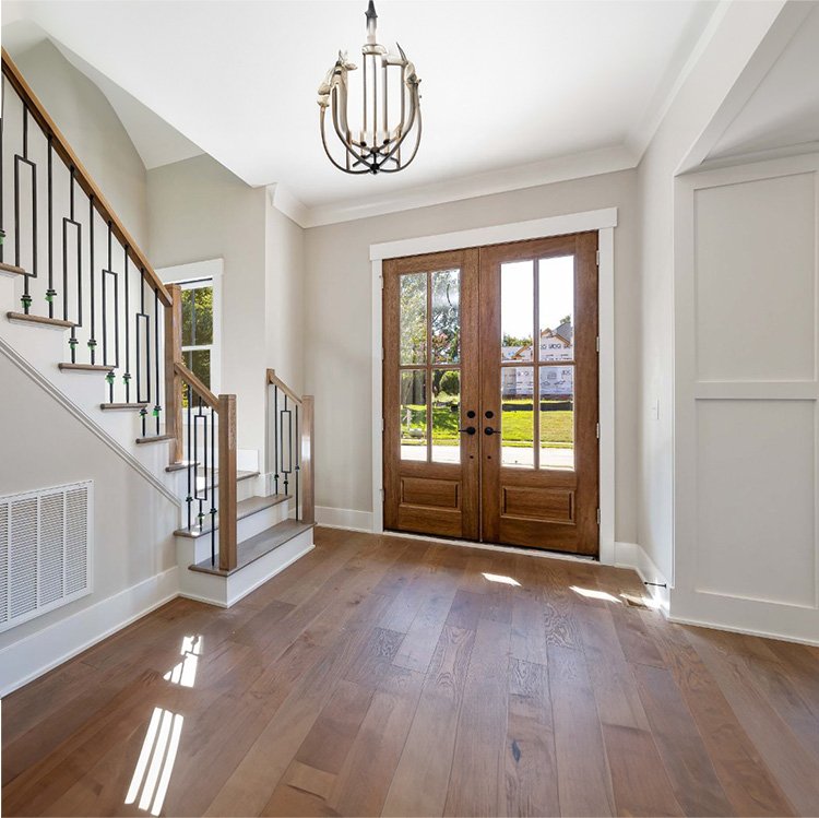 Elegant entryway showcasing door installation services with stylish double doors, enhancing the beauty and functionality of the home.