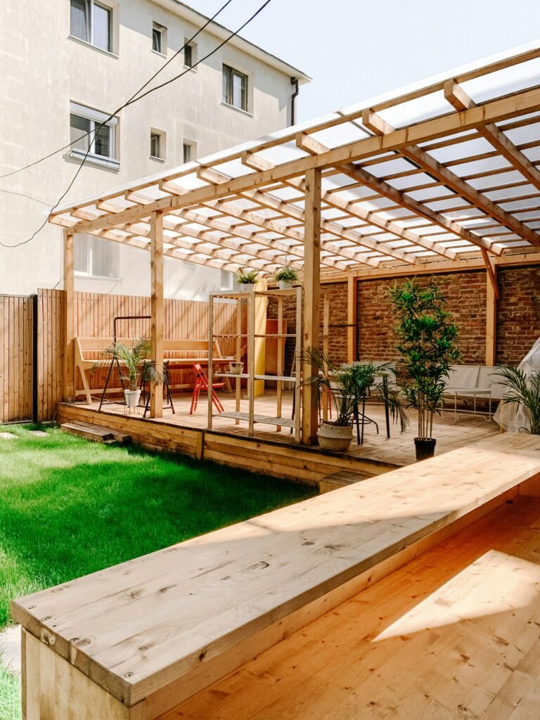 Beautiful outdoor patio with a custom-built wooden pergola and seating area, designed by Duluth Construction, showcasing expert custom carpentry and carpentry services for stylish outdoor spaces.