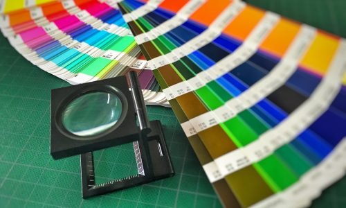 Color swatches and magnifier tool showcasing a variety of vibrant paint options for professional interior and exterior painting services by Duluth Construction.